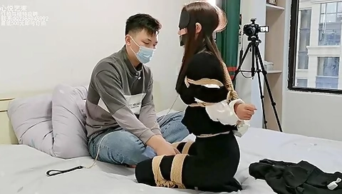 Asian Lady Blindfolded And Bound